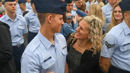 Wesley Brokop and his mother, Ashley Brokop happily hugging after basic training